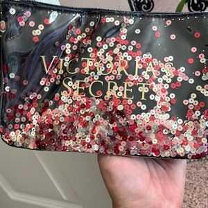 VS clutch zipper wristband never used floating sequins, plastic outside